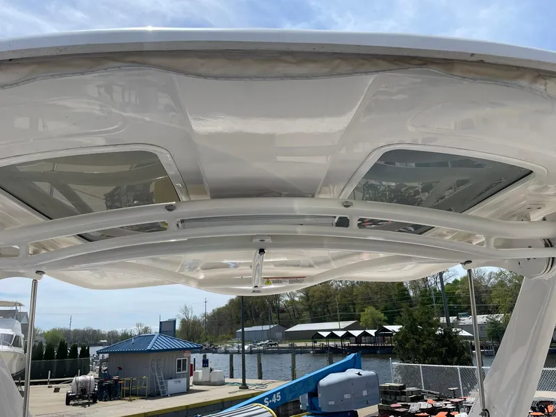 Slide: The Image of 2017 Chaparral 307 SSX boat roof with skylights at marina. - 14