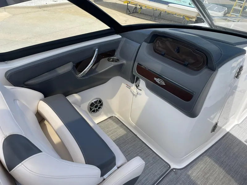 Slide: The Image of 2017 Chaparral 307 SSX boat interior with sleek seating and modern dashboard design. - 15
