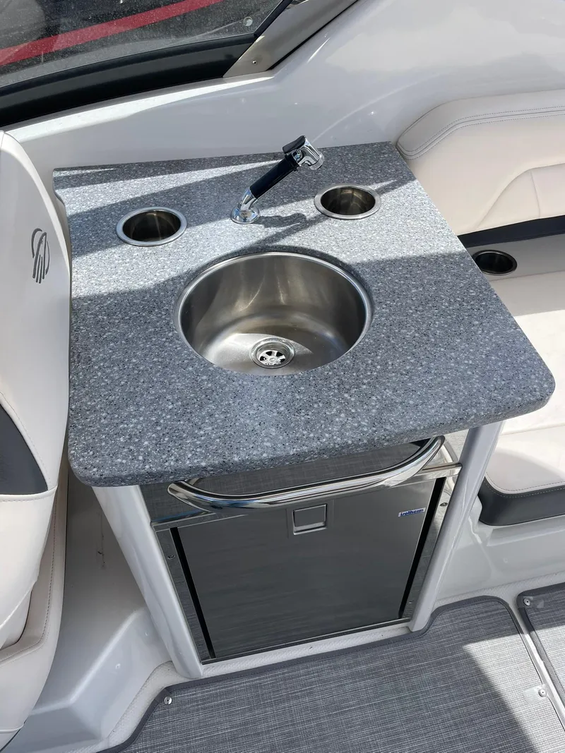 Slide: The Image of 2017 Chaparral 307 SSX boat interior with sink and countertop. - 18