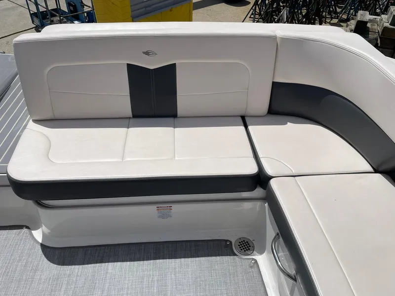 Slide: The Image of 2017 Chaparral 307 SSX boat interior with white and gray seating. - 21