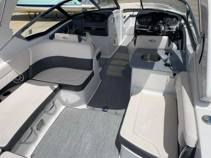 Slide: The Image of 2017 Chaparral 307 SSX boat interior with spacious seating and modern dashboard. - 22