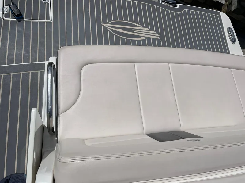 Slide: The Image of 2017 Chaparral 307 SSX boat with beige seating and sleek deck design. - 24