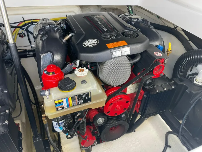 Slide: The Image of Engine compartment of a 2017 Chaparral 307 SSX boat, showcasing detailed components. - 26