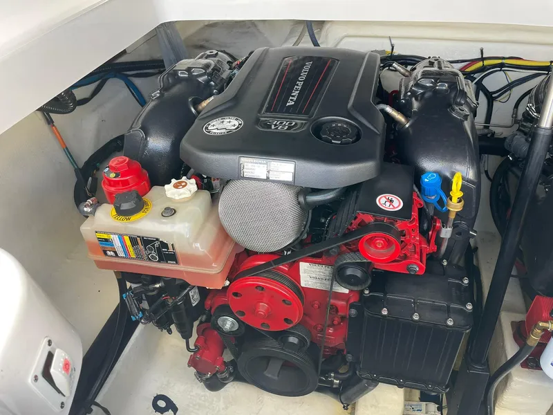 Slide: The Image of Engine compartment of a 2017 Chaparral 307 SSX boat, featuring a Volvo Penta engine. - 27