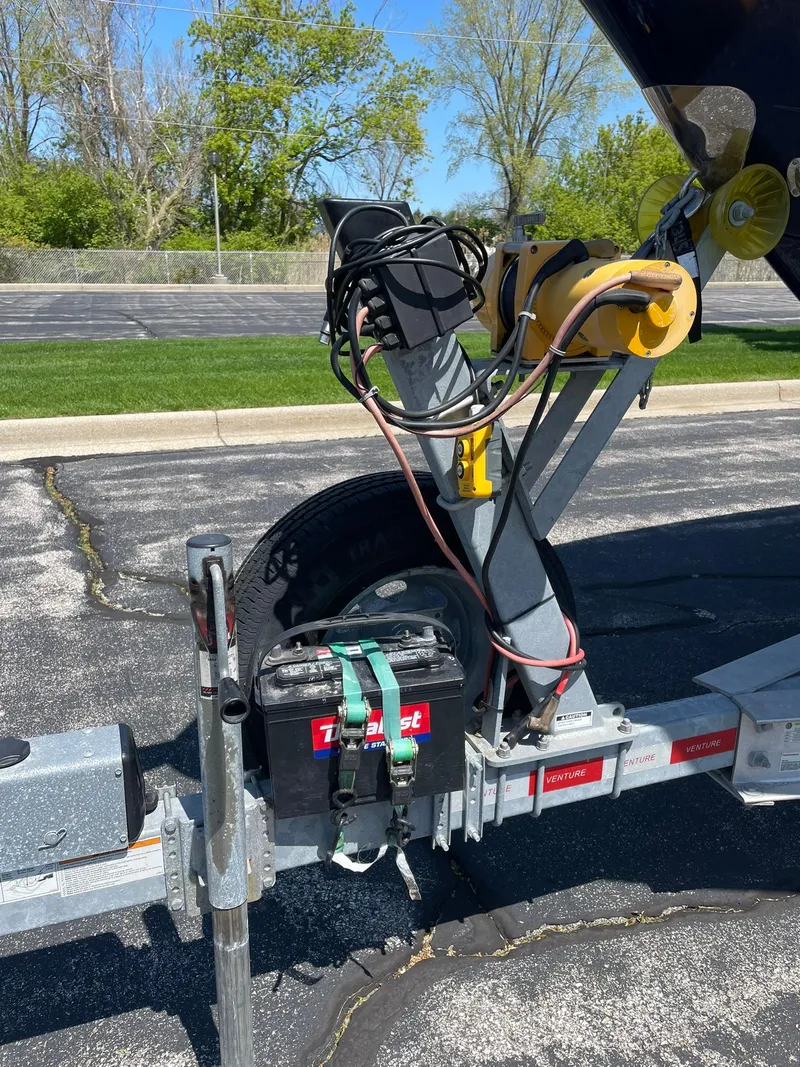 Slide: The Image of Trailer hitch of 2017 Chaparral 307 SSX boat with winch and battery. - 28