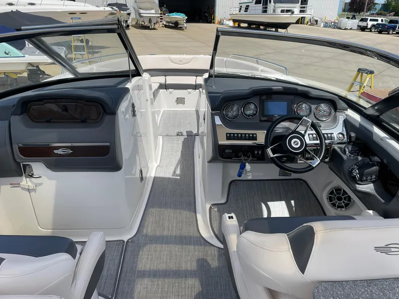 Slide: The Image of 2017 Chaparral 307 SSX boat interior with dual consoles and modern dashboard. - 4