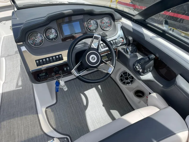 Slide: The Image of Cockpit of 2017 Chaparral 307 SSX boat with steering wheel and control panel. - 5