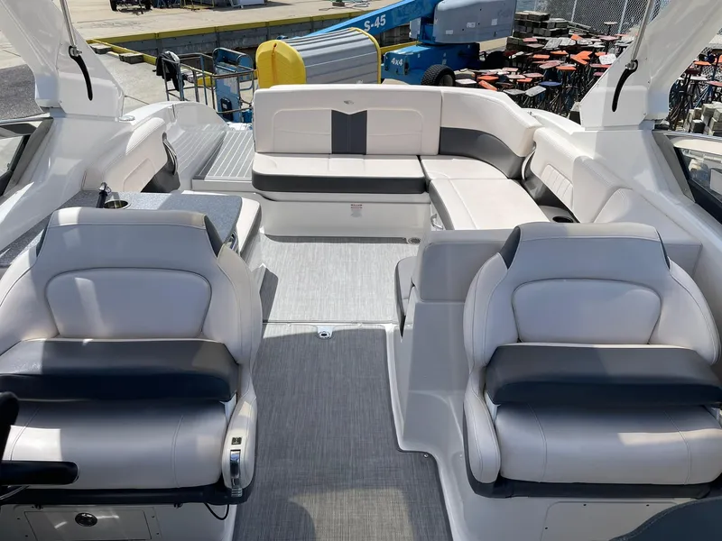 Slide: The Image of 2017 Chaparral 307 SSX boat interior with white seating and modern design. - 8