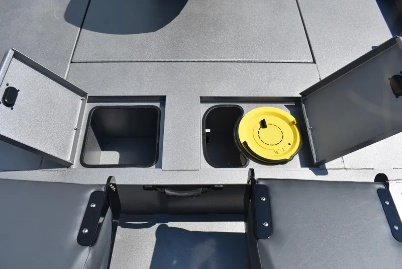 Slide: The Image of 2025 Lowe Outlet 20 boat storage compartments with open lids and yellow hatch. - 10
