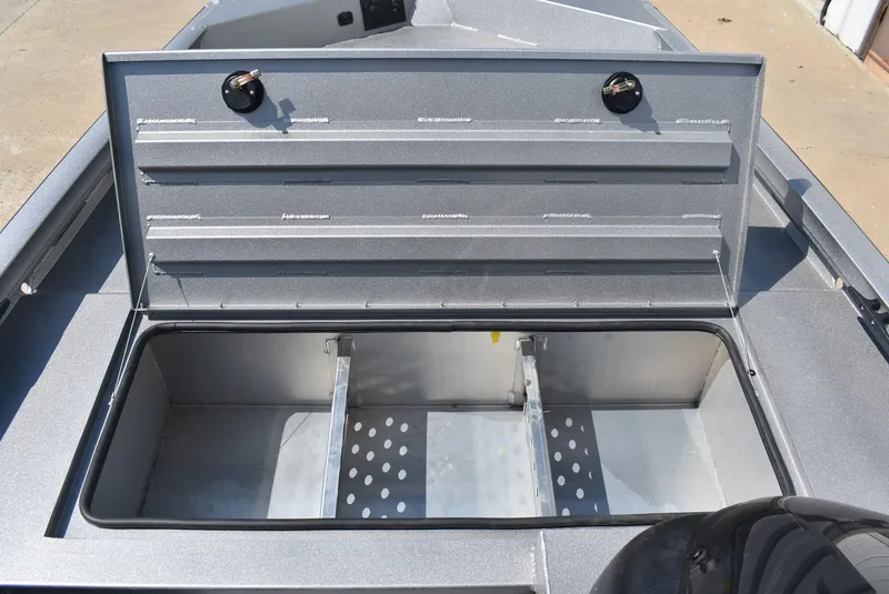 Slide: The Image of Open storage compartment on a 2025 Lowe Outlet 20 boat, showcasing interior space. - 13