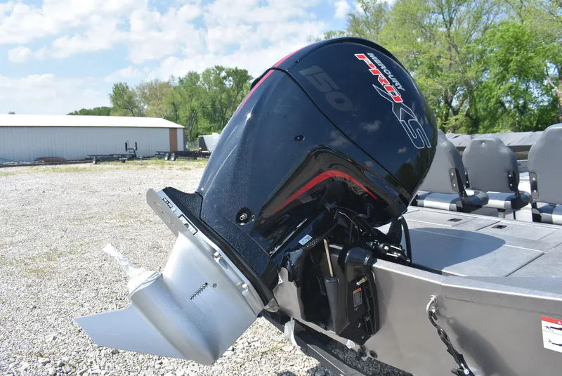 Slide: The Image of 2025 Lowe Outlet 20 boat with powerful outboard motor in a sunny outdoor setting. - 6