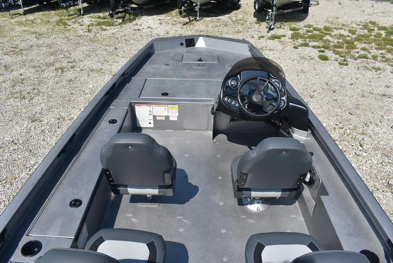 Slide: The Image of 2025 Lowe Outlet 20 boat interior with dual seats and steering console. - 7