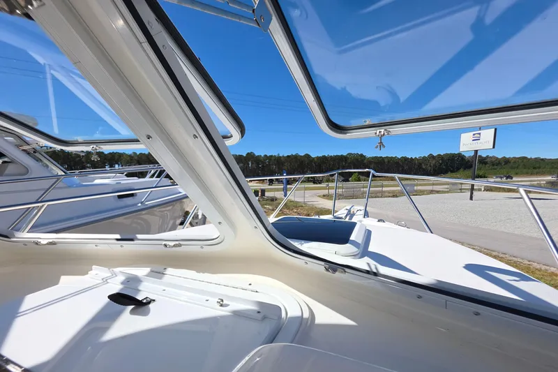 Slide: The Image of 2024 NorthCoast 235 HT boat interior with open windows, showcasing sleek design and outdoor view. - 36