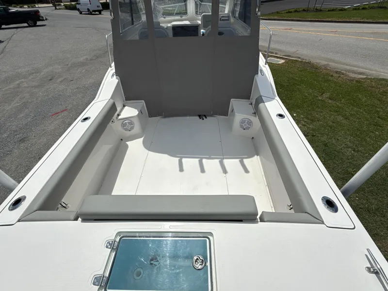 Slide: The Image of 2024 NorthCoast 235 HT boat deck with seating and storage compartments. - 6