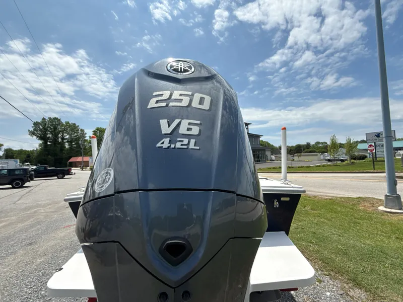 Slide: The Image of 2024 NorthCoast 235 HT boat with 250 V6 4.2L engine, outdoor display. - 7