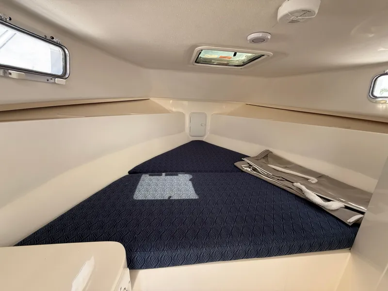 Slide: The Image of 2025 NorthCoast 255 HT helm with steering wheel and control panel. - 9