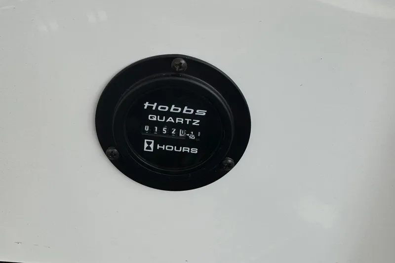 Slide: The Image of Hobbs Quartz hour meter on 2008 Cobalt 230, displaying 152 hours. - 5