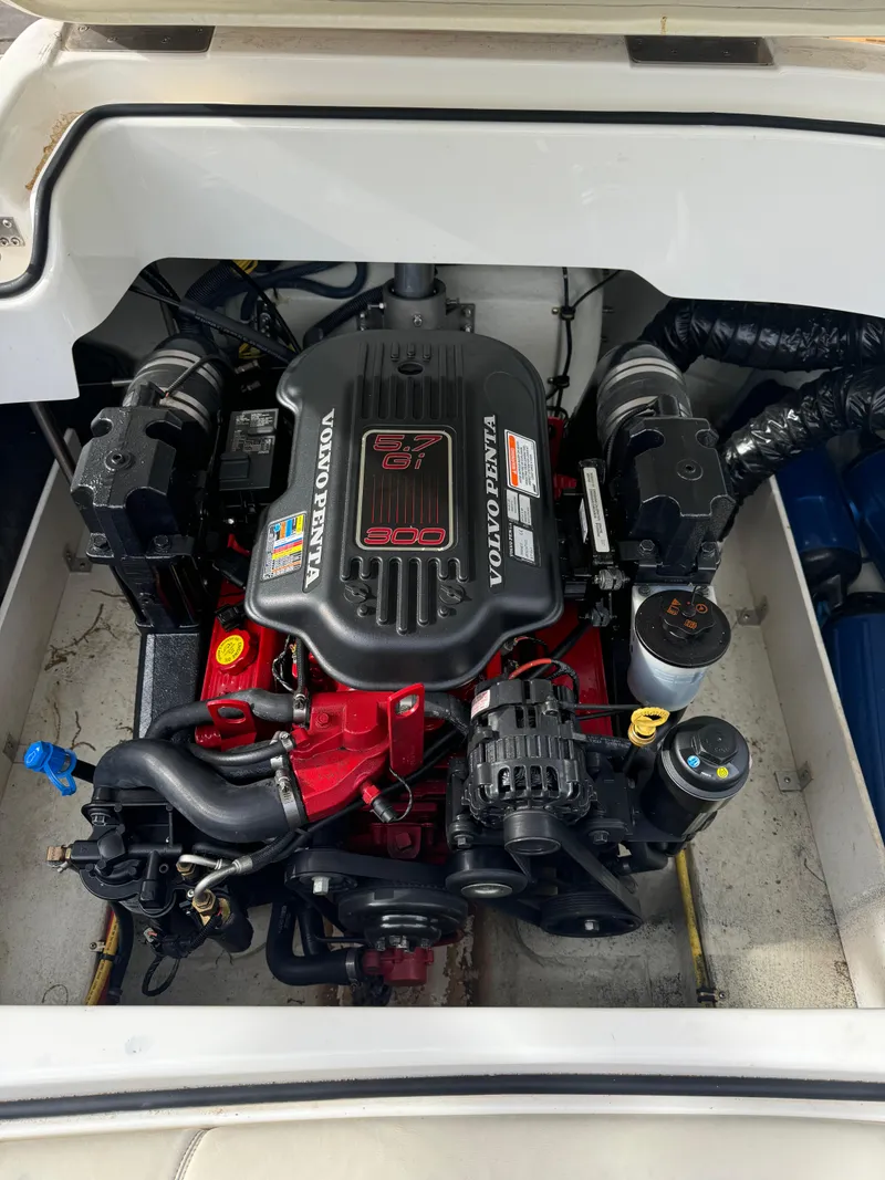 Slide: The Image of 2008 Cobalt 230 boat engine, featuring a Volvo Penta motor in a clean compartment. - 6