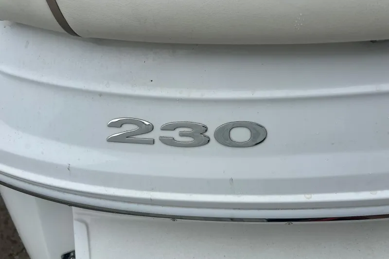 Slide: The Image of 2008 Cobalt 230 boat emblem on white surface. - 7