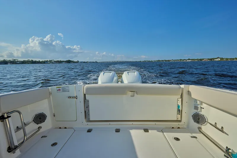 Slide: The Image of Boston Whaler 320 Vantage 2016 boat deck with ocean view and clear blue sky. - 13