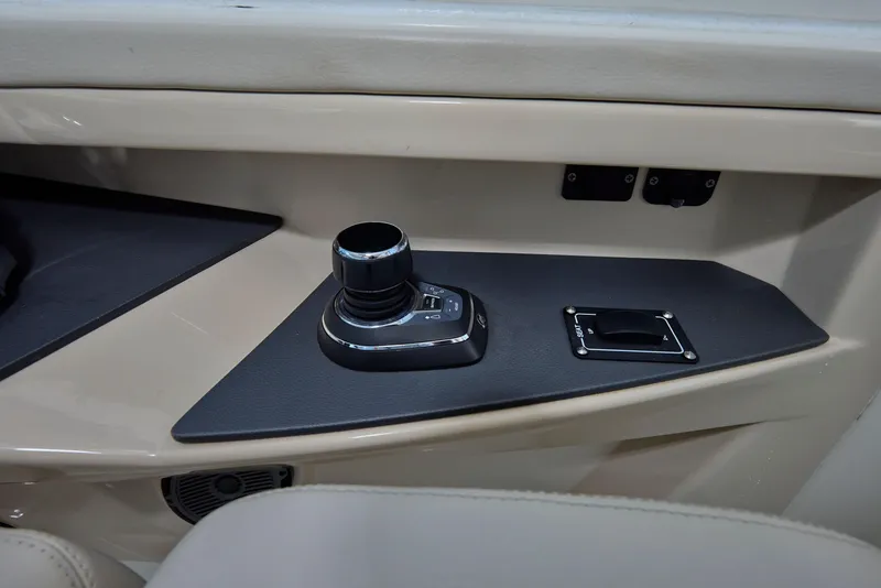 Slide: The Image of Control panel of 2016 Boston Whaler 320 Vantage boat, featuring joystick and switches. - 19