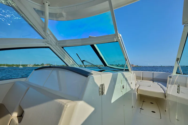 Slide: The Image of 2016 Boston Whaler 320 Vantage boat interior with ocean view and clear blue sky. - 2