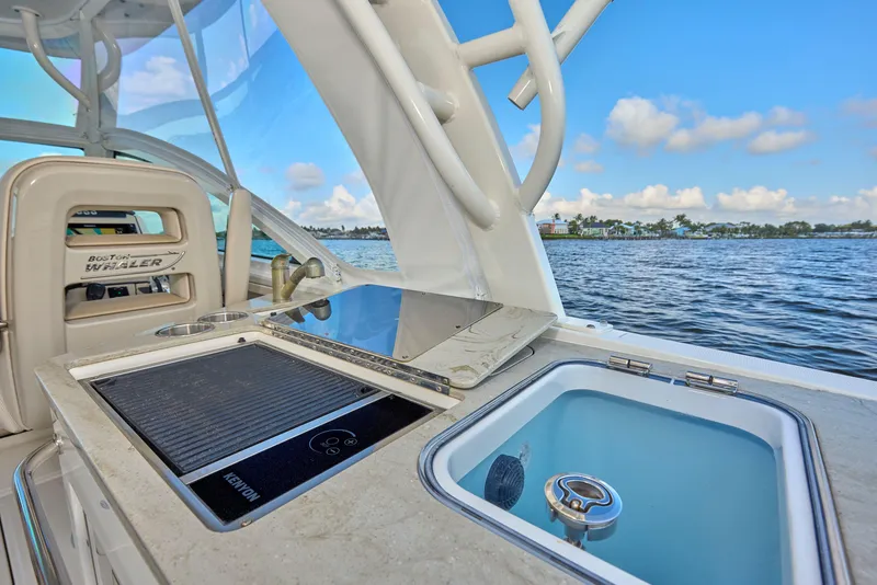 Slide: The Image of 2016 Boston Whaler 320 Vantage boat interior with ocean view, featuring a sleek design. - 21
