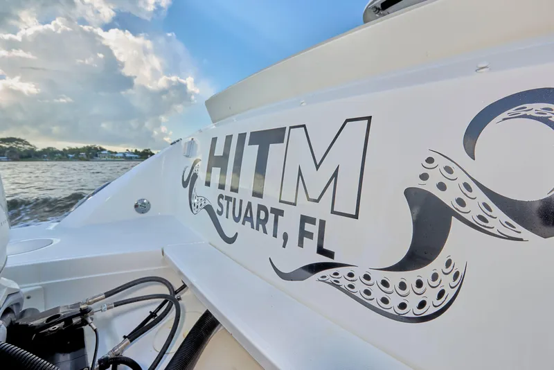 Slide: The Image of 2016 Boston Whaler 320 Vantage boat with "HITM Stuart, FL" decal, ocean background. - 26