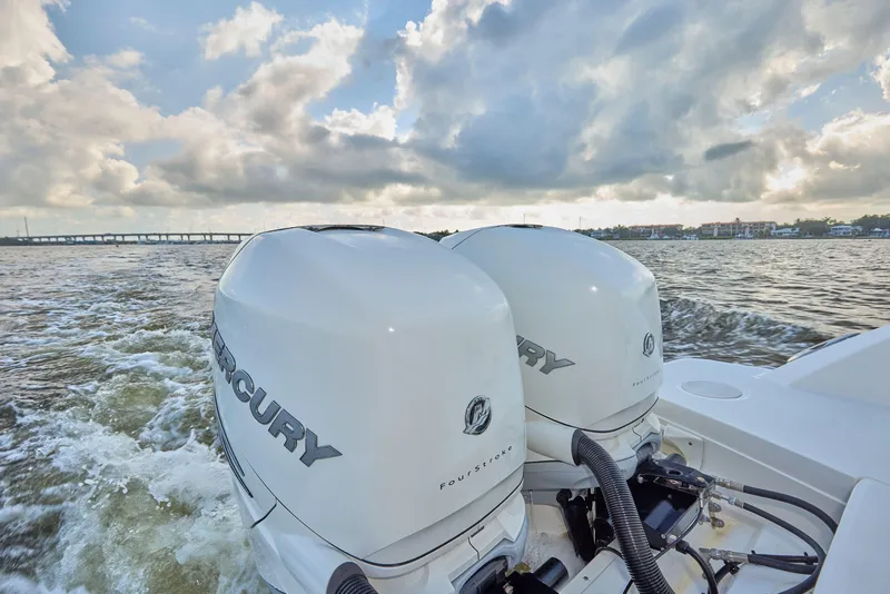 Slide: The Image of Boston Whaler 320 Vantage 2016 with dual Mercury outboard engines on open water. - 27
