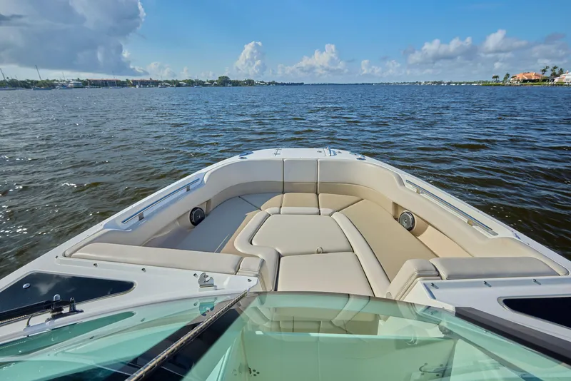 Slide: The Image of Boston Whaler 320 Vantage 2016 boat on calm water, featuring spacious seating and clear skies. - 3