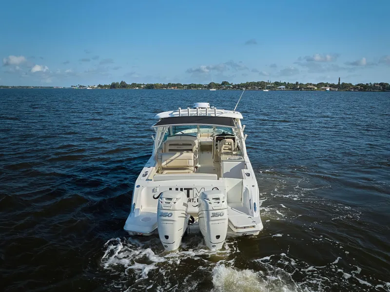 Slide: The Image of 2016 Boston Whaler 320 Vantage boat cruising on open water. - 34