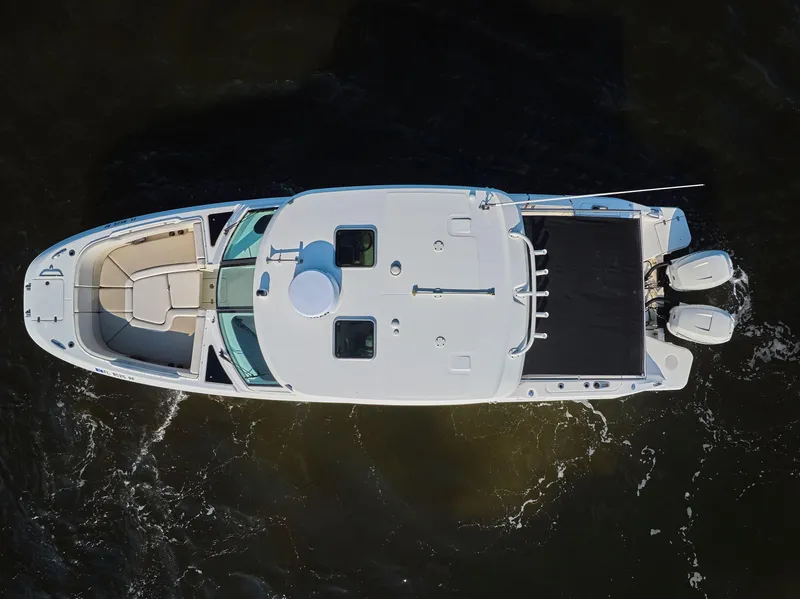Slide: The Image of Aerial view of 2016 Boston Whaler 320 Vantage boat on dark water. - 38