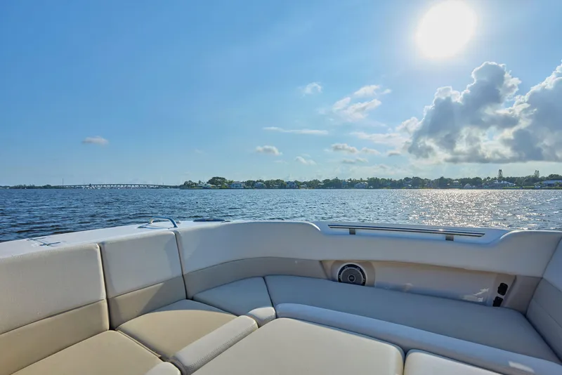 Slide: The Image of Boston Whaler 320 Vantage 2016 boat interior with scenic water view and sunny sky. - 6