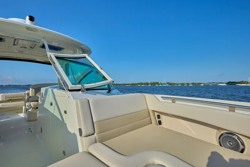 Slide: The Image of 2016 Boston Whaler 320 Vantage boat interior with open water view. - 7