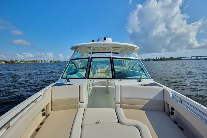 Slide: The Image of 2016 Boston Whaler 320 Vantage boat on calm water under blue sky. - 9
