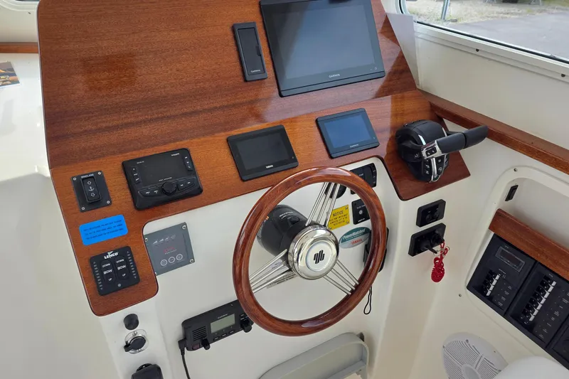 Slide: The Image of 2024 NorthCoast 315 HT helm with modern controls and navigation displays. - 1