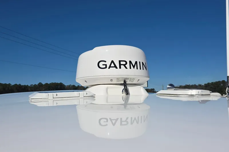 Slide: The Image of Garmin radar on 2024 NorthCoast 315 HT boat against clear blue sky. - 12