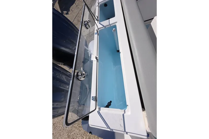 Slide: The Image of 2024 NorthCoast 315 HT boat livewell with open lid, showcasing interior features. - 16