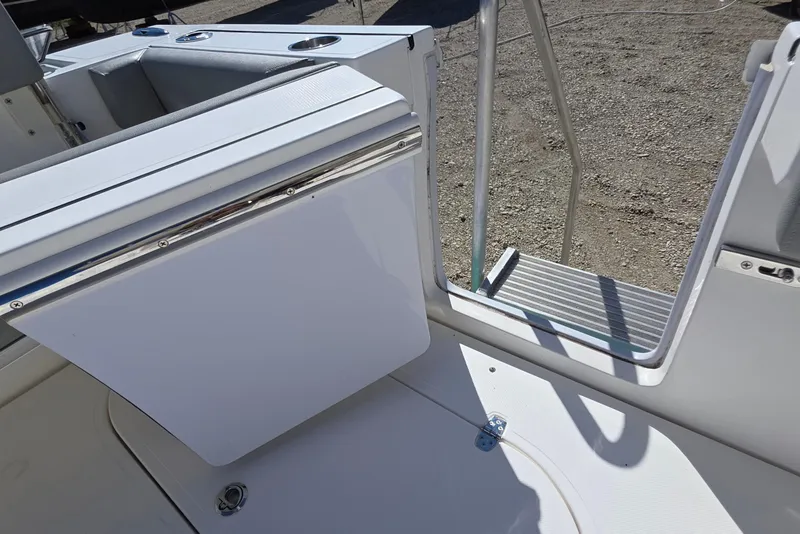 Slide: The Image of 2024 NorthCoast 315 HT boat interior with open door and step detail. - 20