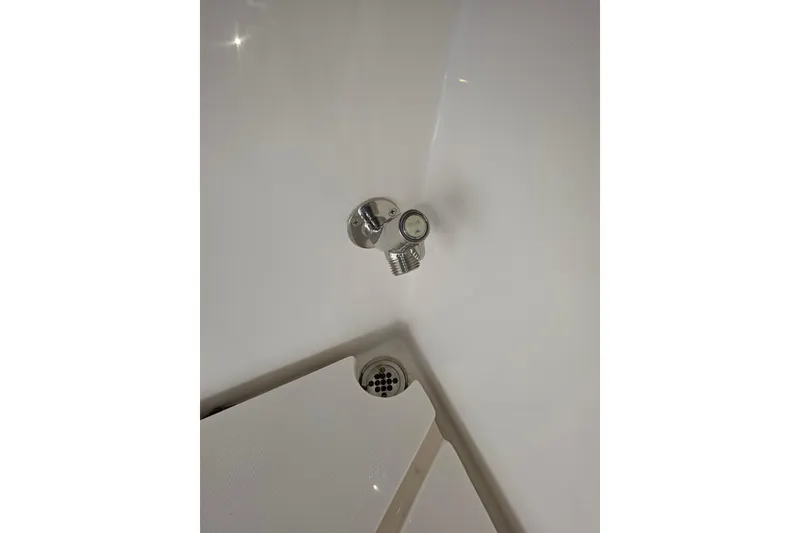 Slide: The Image of 2024 NorthCoast 315 HT boat interior detail with drain and fixture. - 21