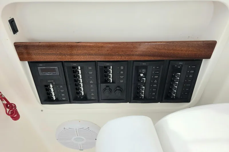 Slide: The Image of 2024 NorthCoast 315 HT electrical panel with switches and controls. - 9