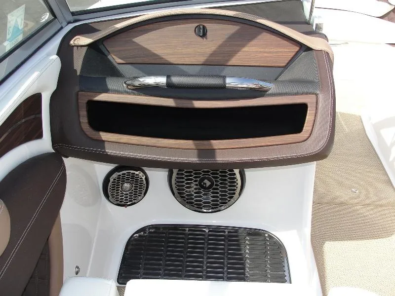 Slide: The Image of Interior of 2013 Cobalt A25 boat with wood accents and speaker system. - 18