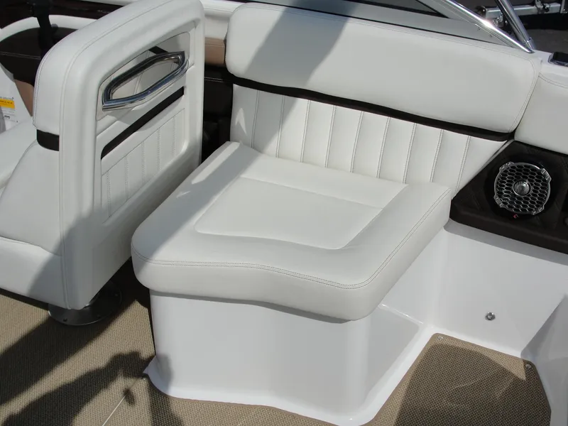 Slide: The Image of 2013 Cobalt A25 boat with white leather seating and speaker detail. - 19