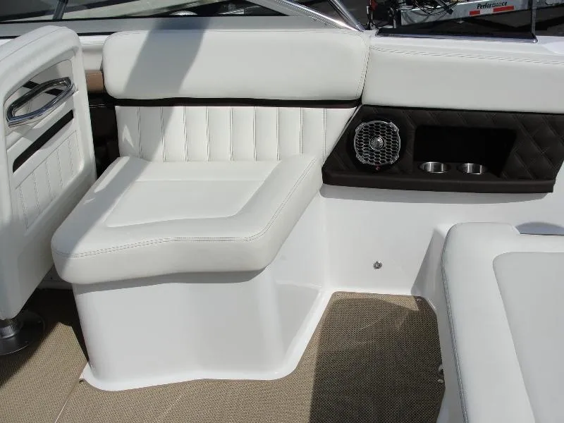 Slide: The Image of Interior seating of a 2013 Cobalt A25 boat with white upholstery and speaker. - 20