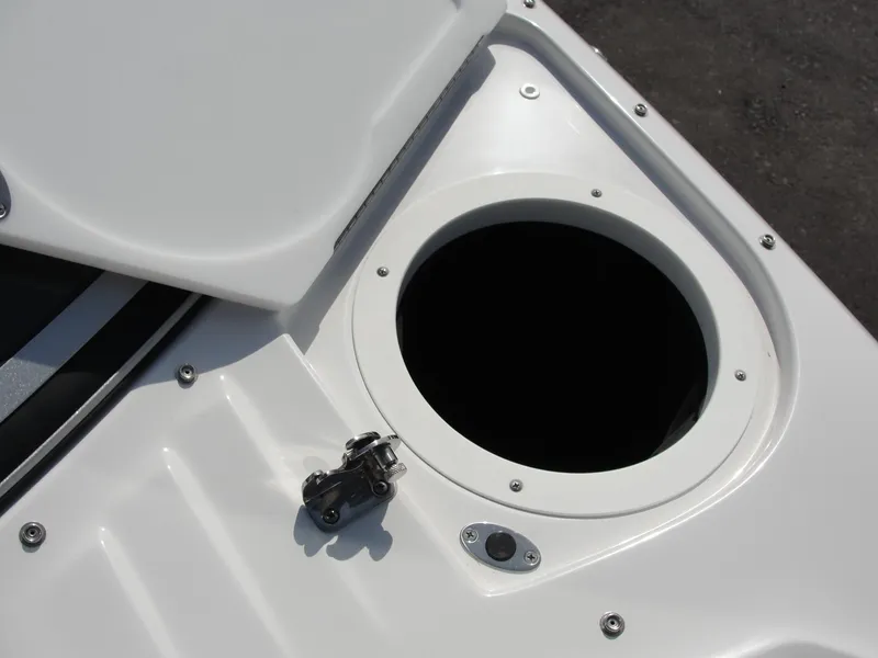 Slide: The Image of 2013 Cobalt A25 boat storage compartment with open hatch, showcasing sleek design. - 26