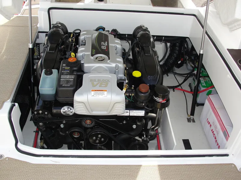 Slide: The Image of Engine compartment of a 2013 Cobalt A25 boat, showcasing a powerful inboard motor. - 31
