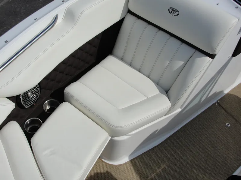 Slide: The Image of Luxurious white seating in 2013 Cobalt A25 boat, featuring cup holders and premium stitching. - 41