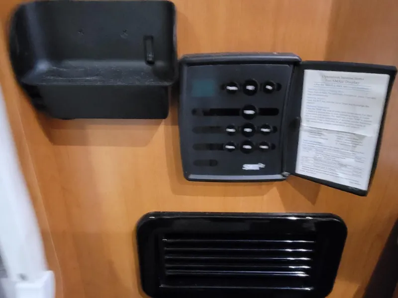 Slide: The Image of Control panel on 2003 Four Winns 248 Vista boat interior, featuring switches and instructions. - 12