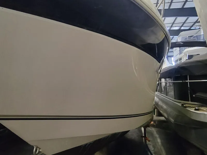 Slide: The Image of 2003 Four Winns 248 Vista boat in storage, side view. - 17