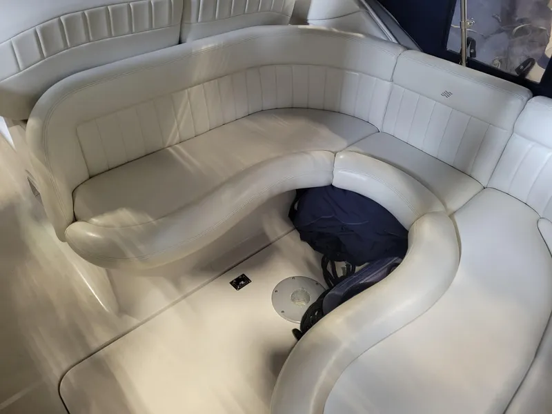 Slide: The Image of 2003 Four Winns 248 Vista boat interior with white leather seating. - 7